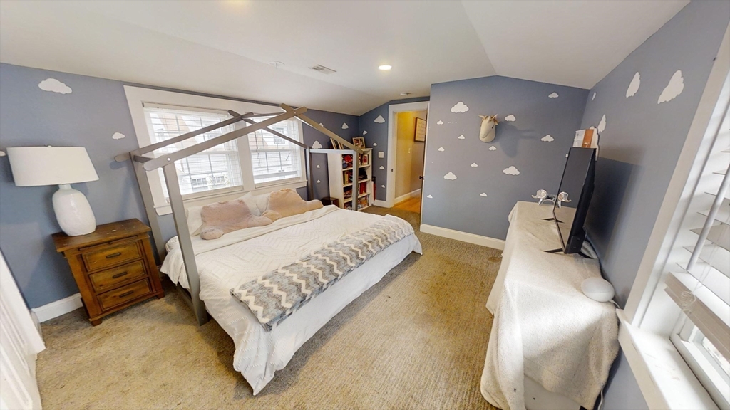 223 Old Common Road Lancaster, MA 01523 - Photo 17 of 31 a bedroom with a large bed and a large mirror on the dresser