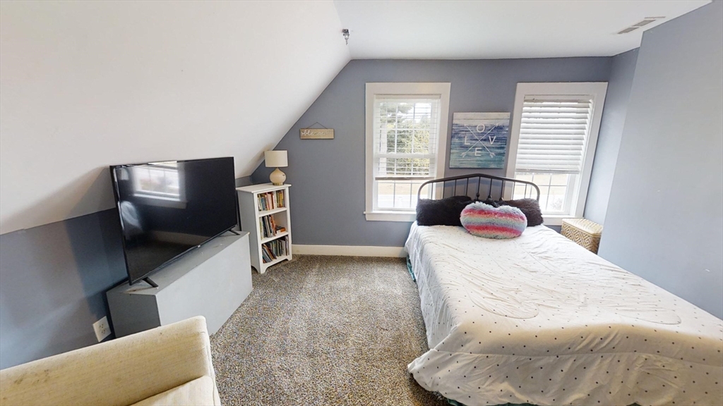 223 Old Common Road Lancaster, MA 01523 - Photo 18 of 31 a bedroom with a bed and flat screen tv
