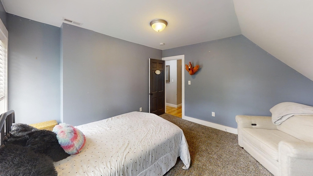 223 Old Common Road Lancaster, MA 01523 - Photo 19 of 31 a bedroom with a bed and a window