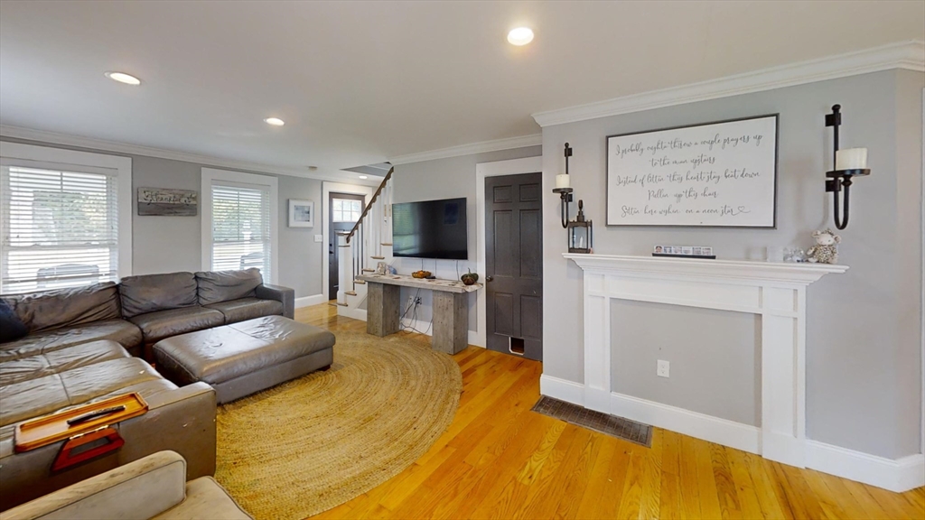 223 Old Common Road Lancaster, MA 01523 - Photo 3 of 31 a living room with furniture and a flat screen tv