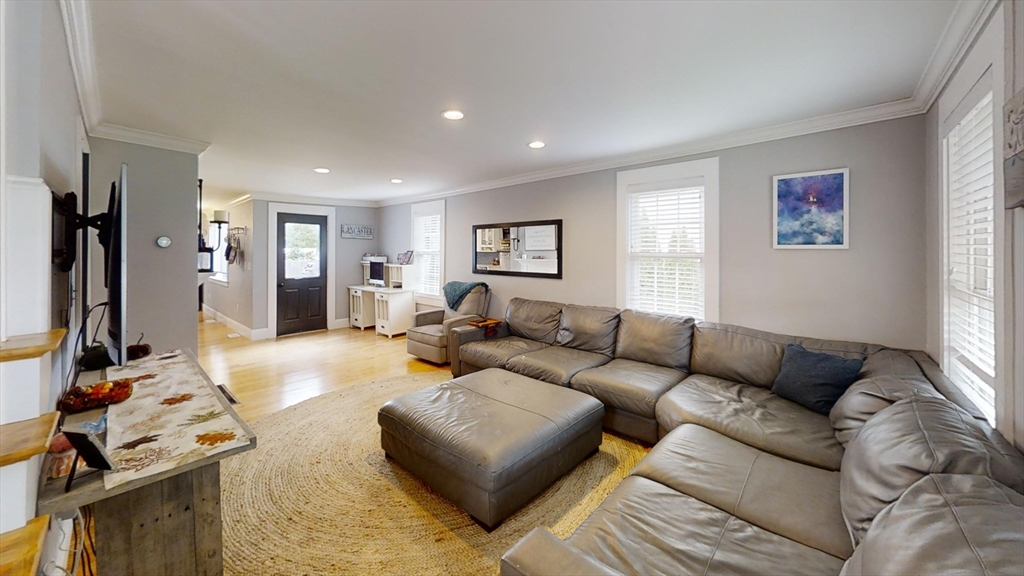 223 Old Common Road Lancaster, MA 01523 - Photo 4 of 31 a living room with furniture and a flat screen tv