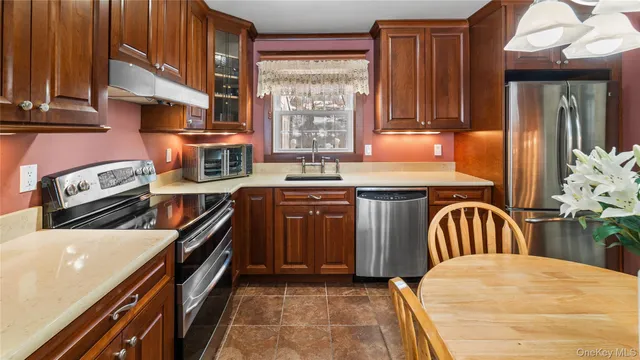 a view of a chair and backyard of the house