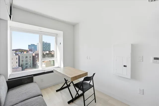 a view of a room with furniture and windows