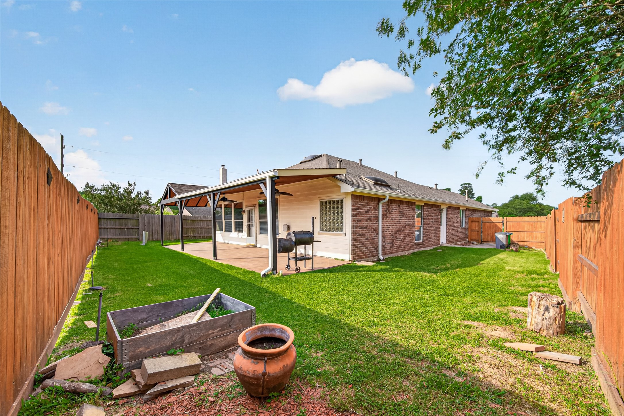23914 Glengate Drive Spring, TX 77373 - Photo 45 of 49 a view of a house with a backyard and porch
