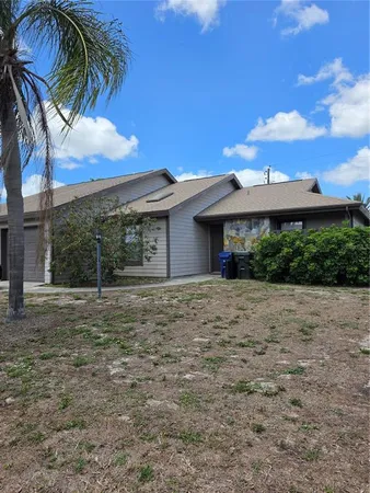 a view of a house with a yard