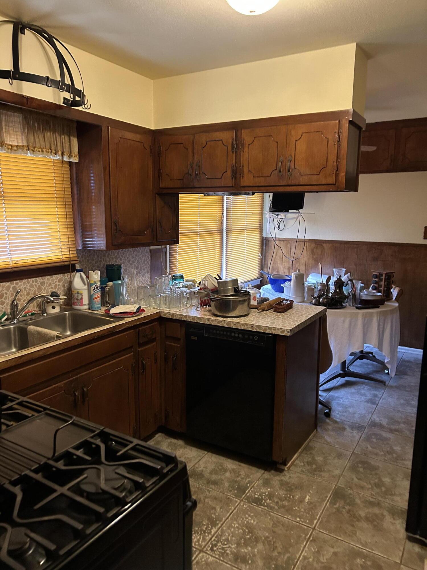 2802 Walnut Avenue Lubbock, TX 79404 - Photo 5 of 13 a kitchen with stainless steel appliances granite countertop a stove and a sink