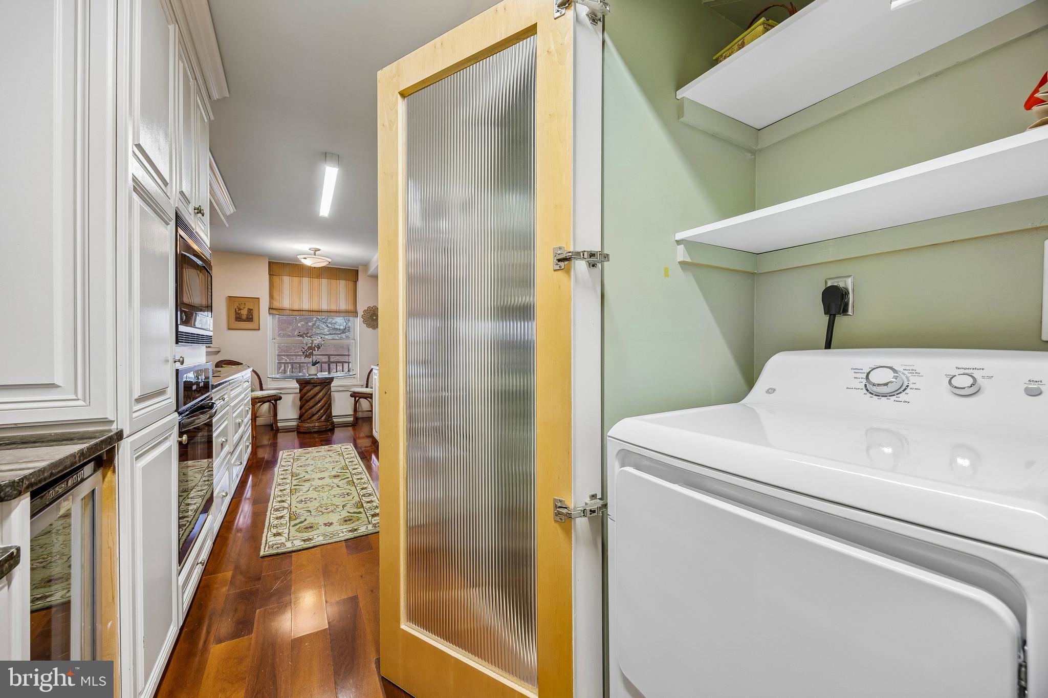 41 Conshohocken State Road, Unit 603 Bala Cynwyd, PA 19004 - Photo 11 of 25 Full Washer and Dryer behind glass fluted doors