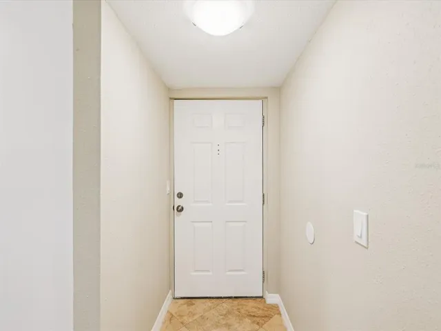 a kitchen with stainless steel appliances granite countertop a stove and a white cabinets