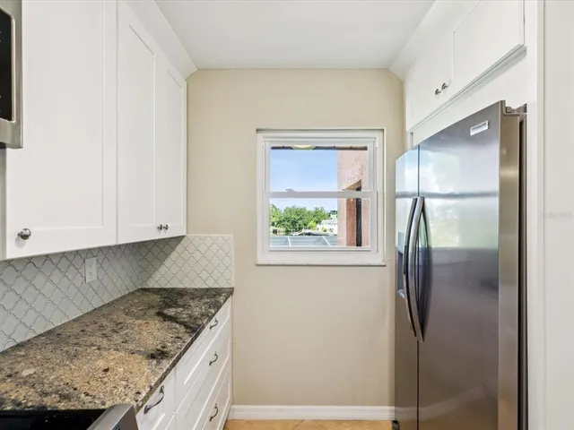 a view of a kitchen with a sink and dishwasher