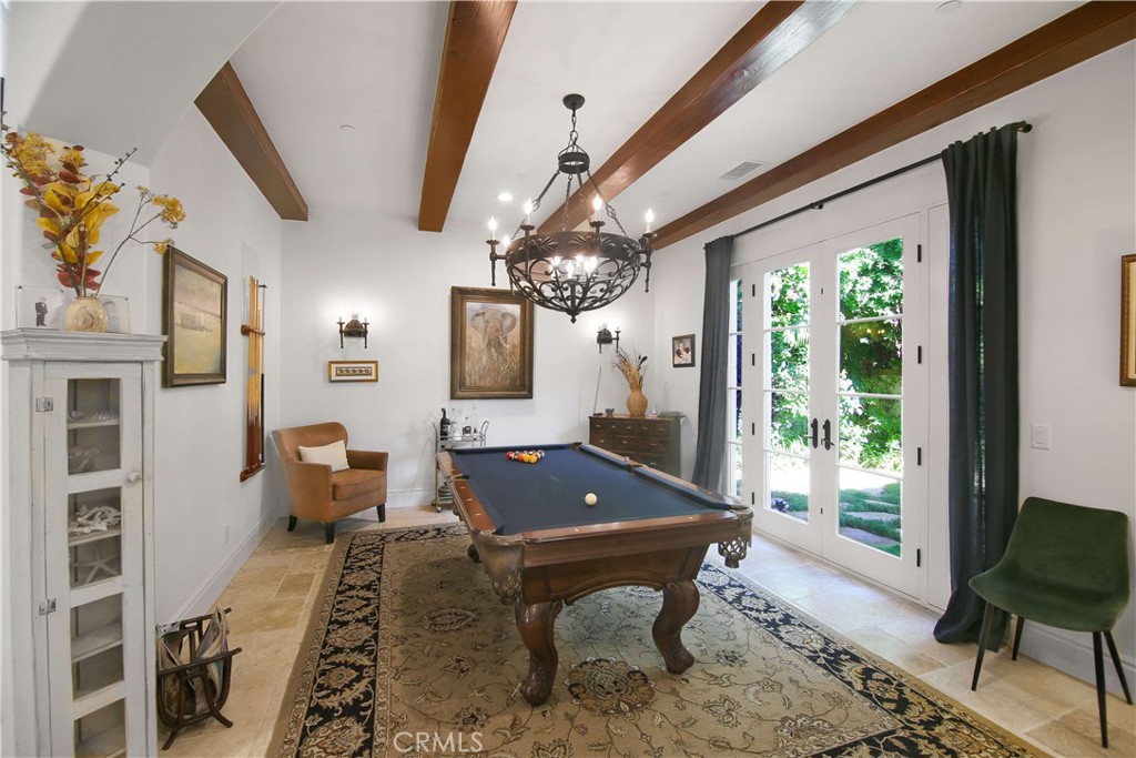 1015 Gardena Road Encinitas, CA 92024 - Photo 11 of 42 a room with wooden floor pool table and windows