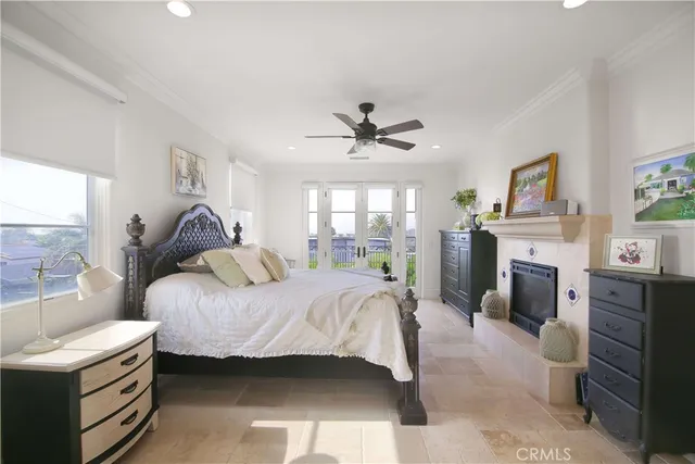 a bedroom with a bed and a fireplace