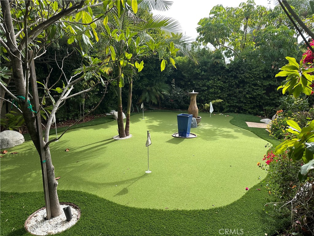 1015 Gardena Road Encinitas, CA 92024 - Photo 38 of 42 a swimming pool with some trees and plants