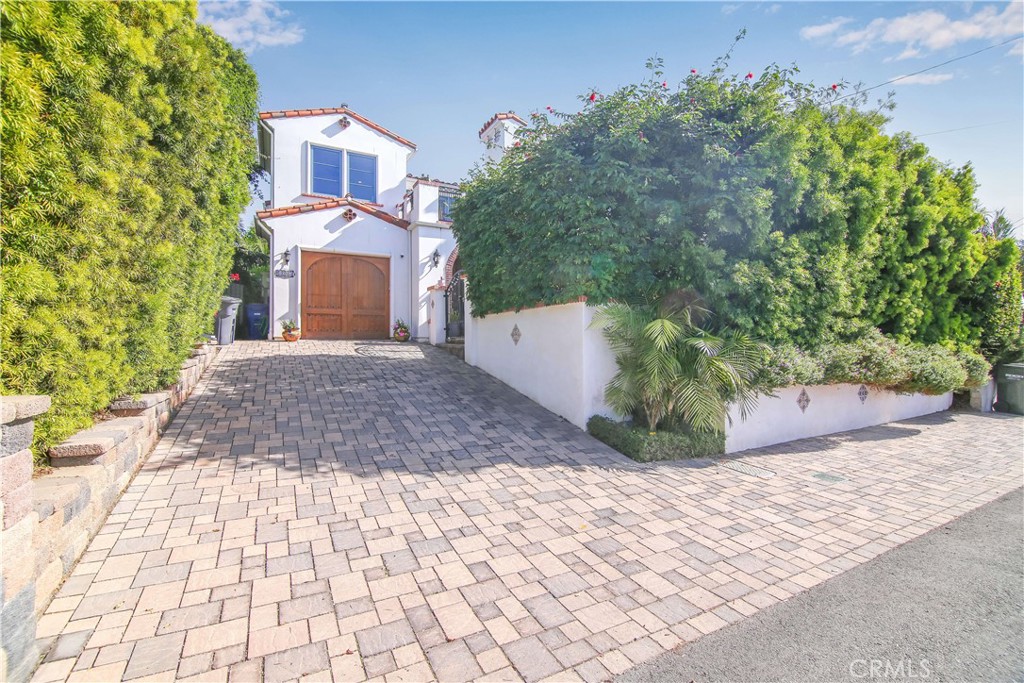 1015 Gardena Road Encinitas, CA 92024 - Photo 40 of 42 a view of a brick house with a yard