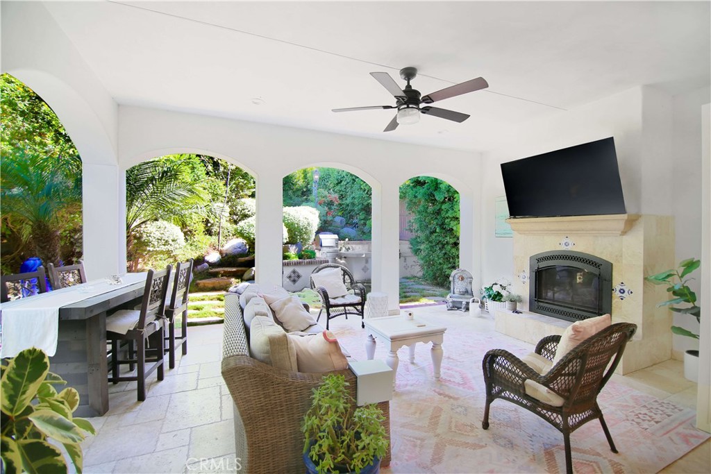 1015 Gardena Road Encinitas, CA 92024 - Photo 8 of 42 a living room with furniture a fireplace and a flat screen tv