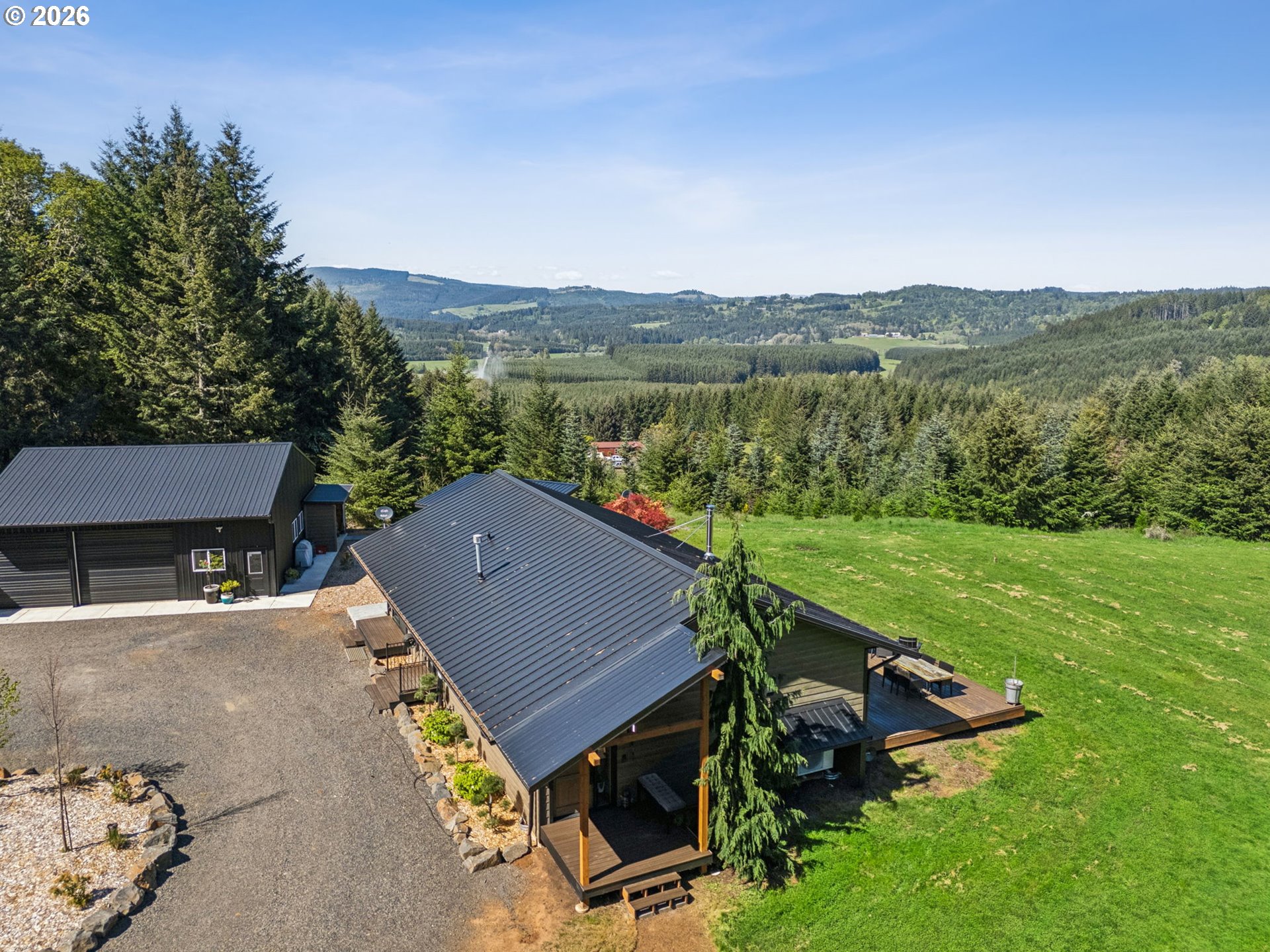 18600 Northwest Meadowlake Road Yamhill, OR 97148 - Photo 4 of 47 an aerial view of a house with big yard