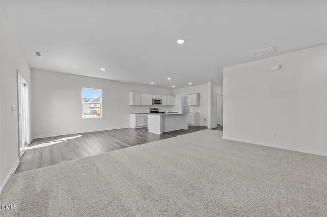 a view of a kitchen with a sink and a window