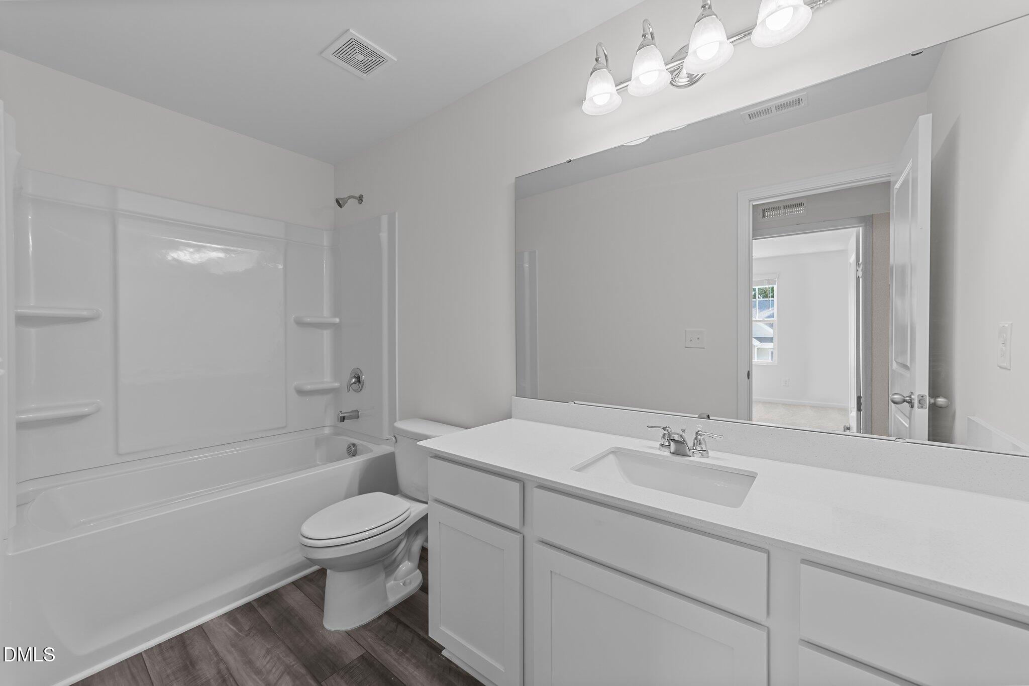 333 Shiloh Way Mebane, NC 27302 - Photo 33 of 35 a bathroom with a sink a toilet and bathtub