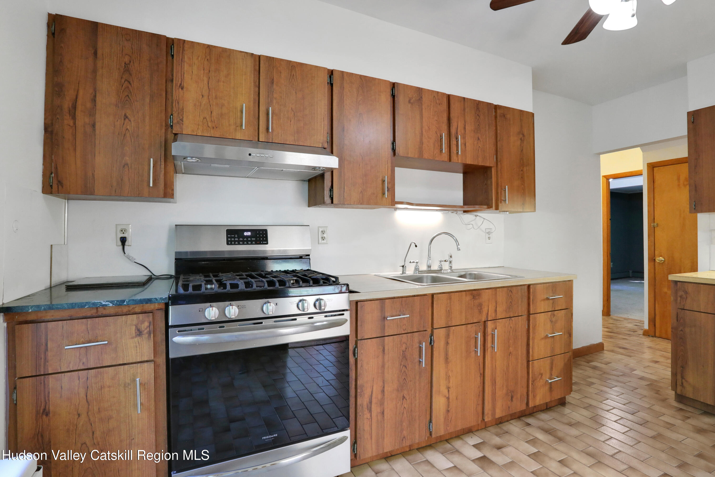 197 Old Rte 32 Saugerties, NY 12477 - Photo 10 of 31 a kitchen with stainless steel appliances granite countertop a stove a sink and a refrigerator