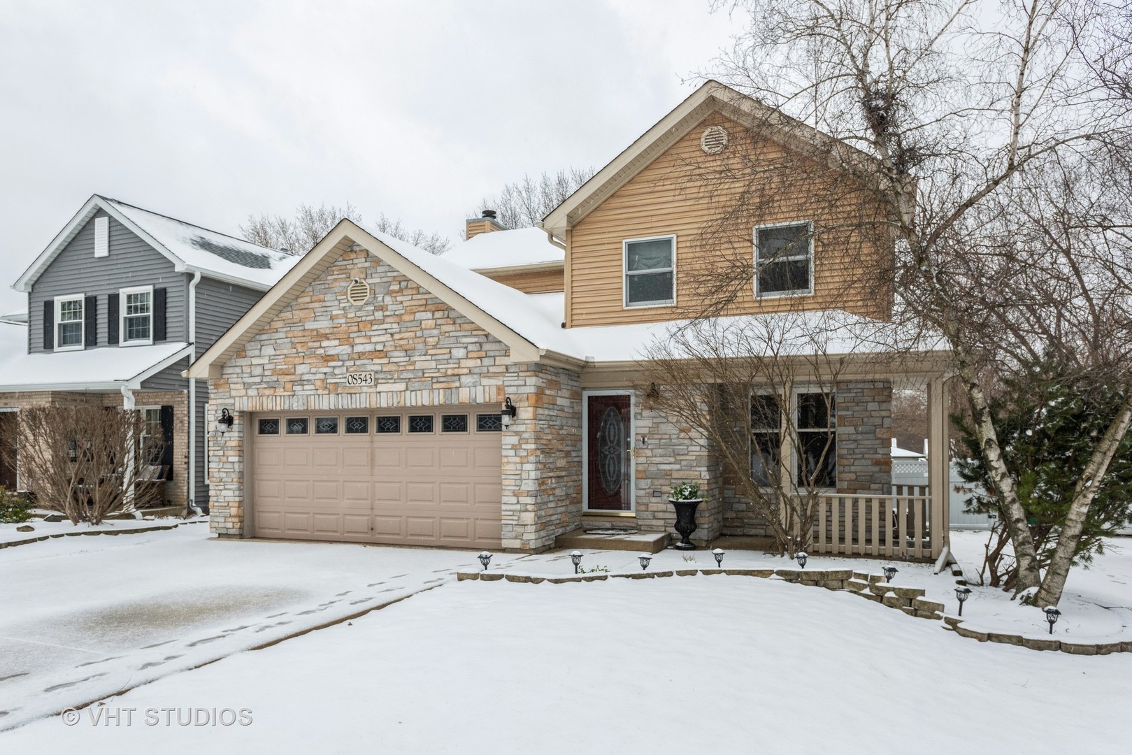 S543 Robbins Street Winfield, IL 60190 - Photo 2 of 17 a front view of a house with a yard and garage