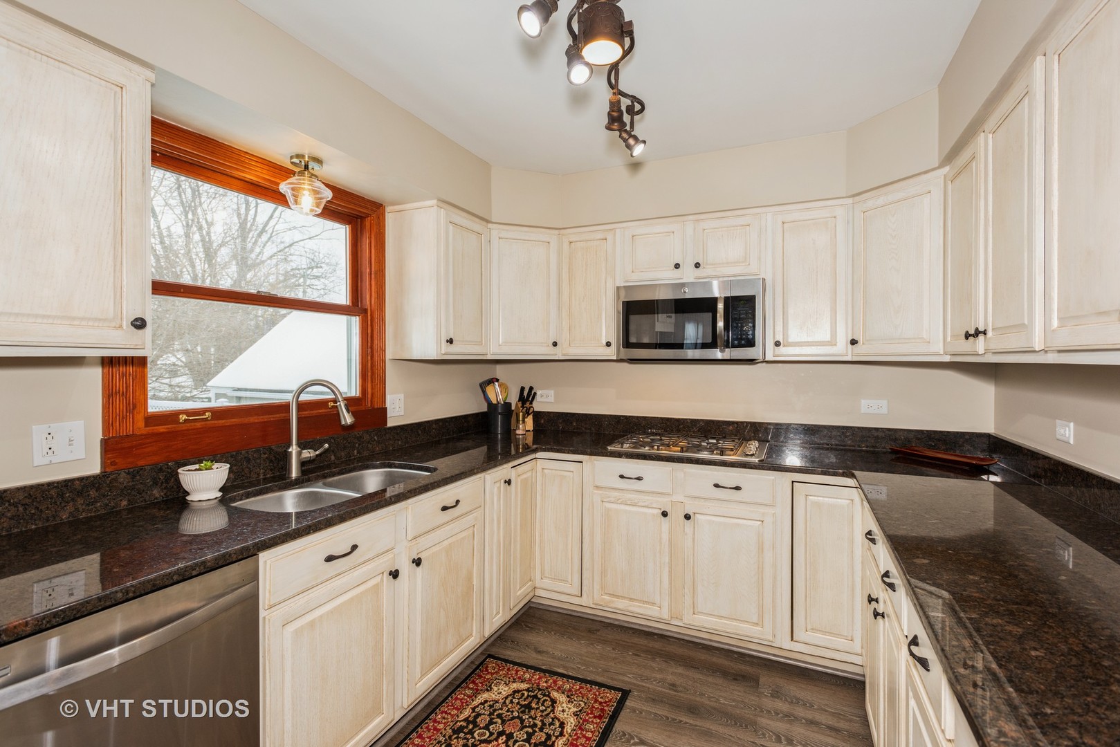 S543 Robbins Street Winfield, IL 60190 - Photo 5 of 17 a kitchen with granite countertop white cabinets white appliances and a sink