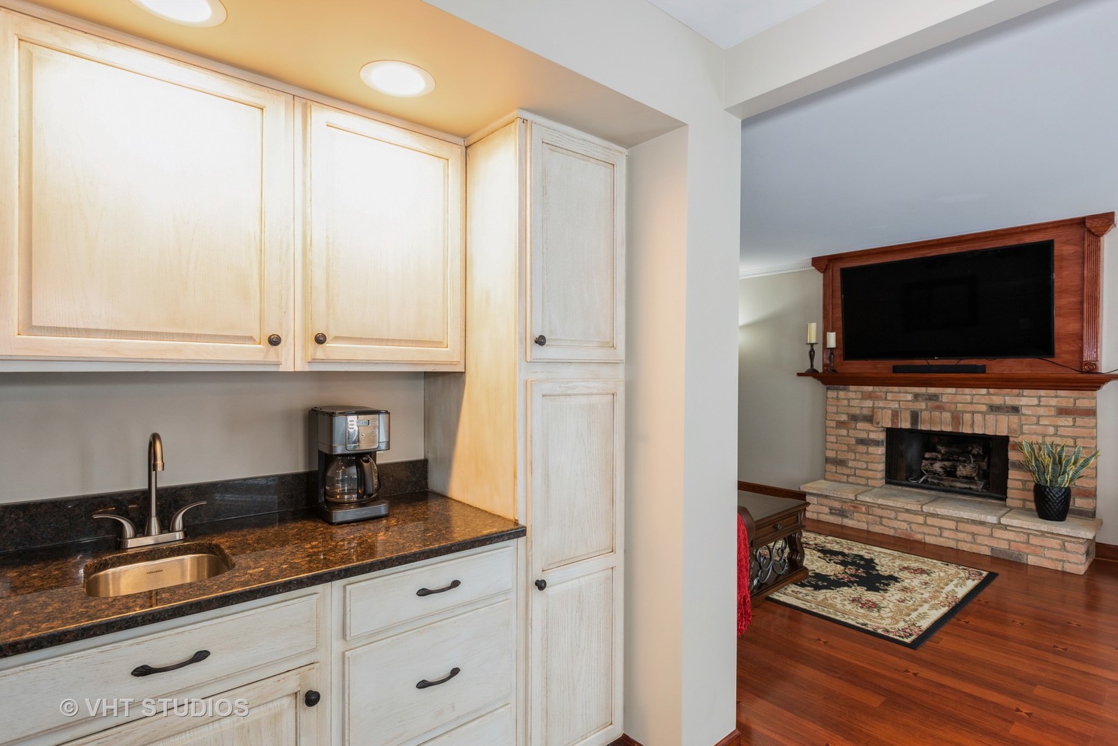 S543 Robbins Street Winfield, IL 60190 - Photo 8 of 17 a living room with furniture a fireplace and flat screen tv