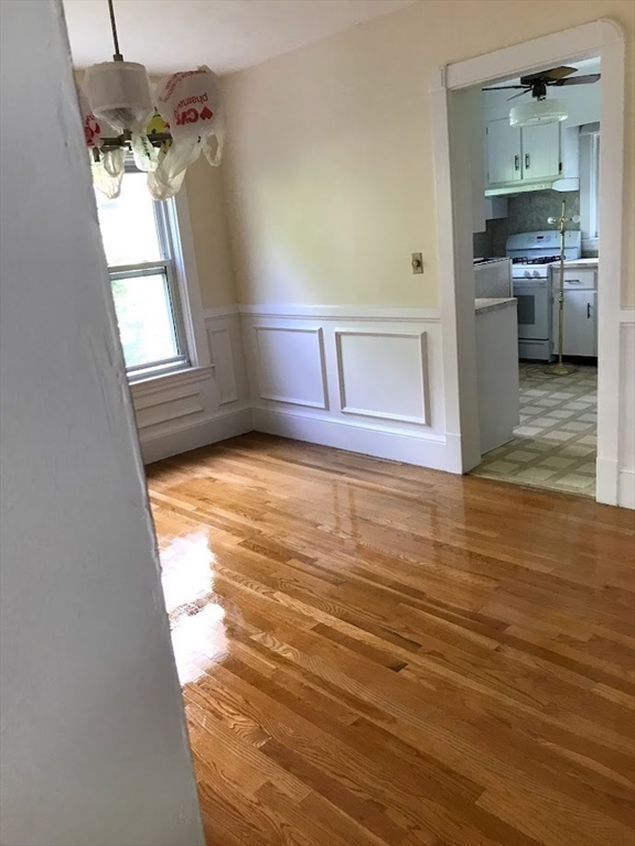 28 Beaconsfield Road, Unit 1 Brookline, MA 02445 - Photo 7 of 21 a view of a kitchen cabinets and a wooden floor
