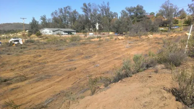 a view of dirt yard and mountain view