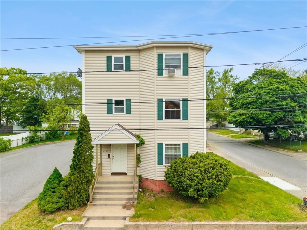 35 Hazel Street, Unit B Attleboro, MA 02703 - Photo 2 of 21 a front view of a house with garden