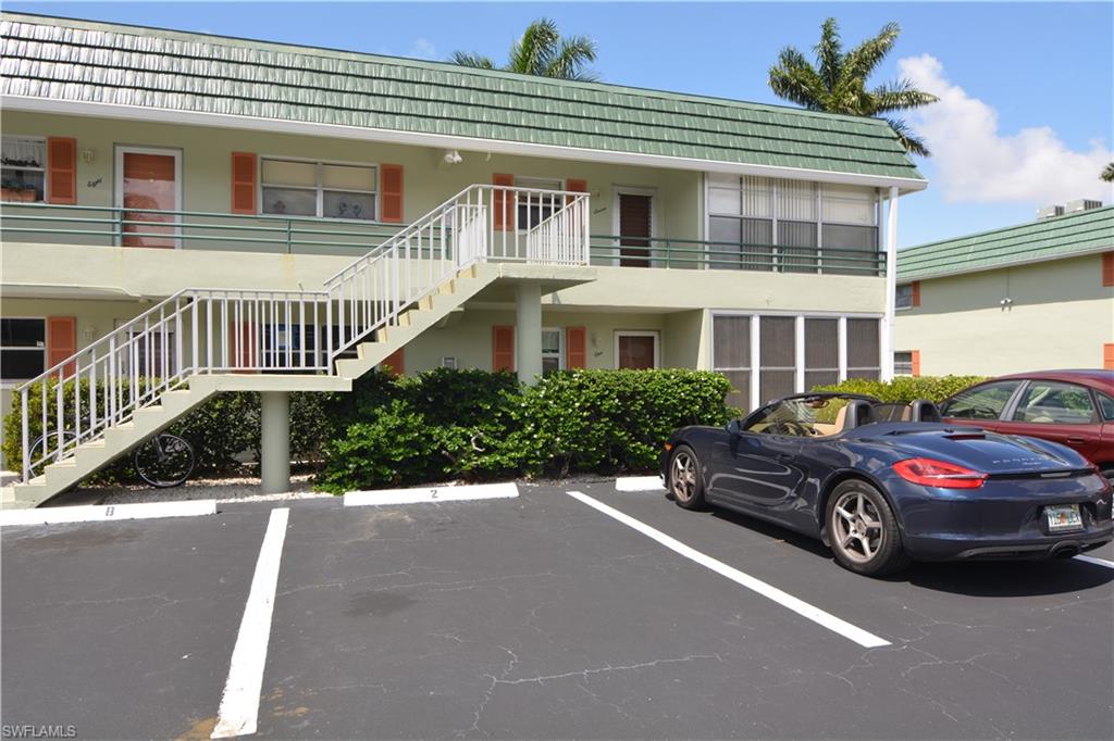 300 Valley Stream Drive, Unit A7 Naples, FL 34113 - Photo 19 of 23 a car parked in front of a house