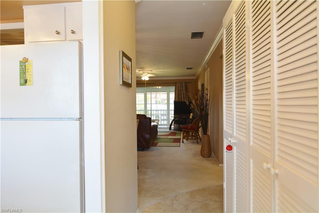 300 Valley Stream Drive, Unit A7 Naples, FL 34113 - Photo 2 of 23 a view of living room with furniture and a window