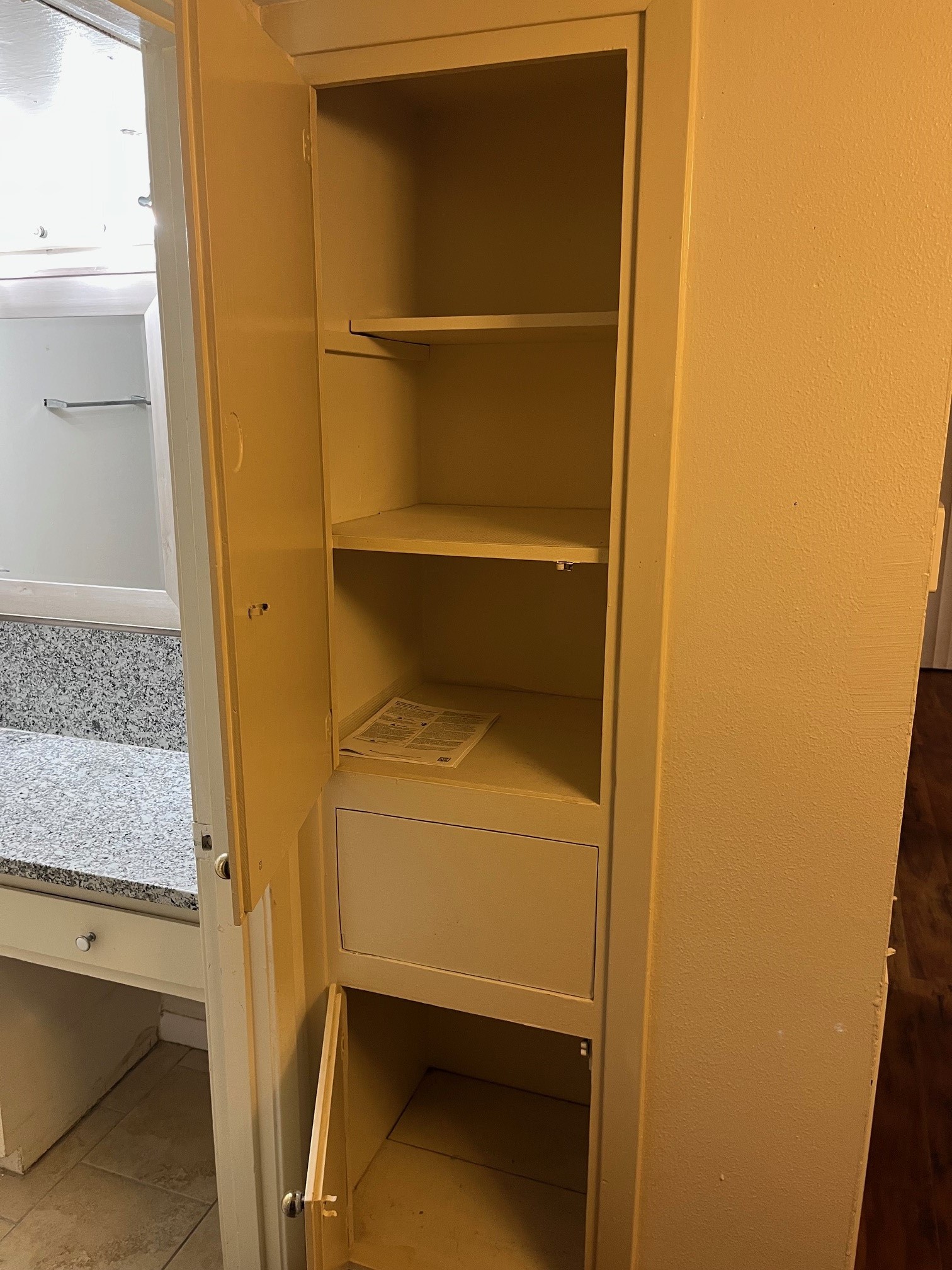 3938 West Alabama Street, Unit 12 Houston, TX 77027 - Photo 23 of 25 Built-in hallway storage cabinet offering extra organization space.