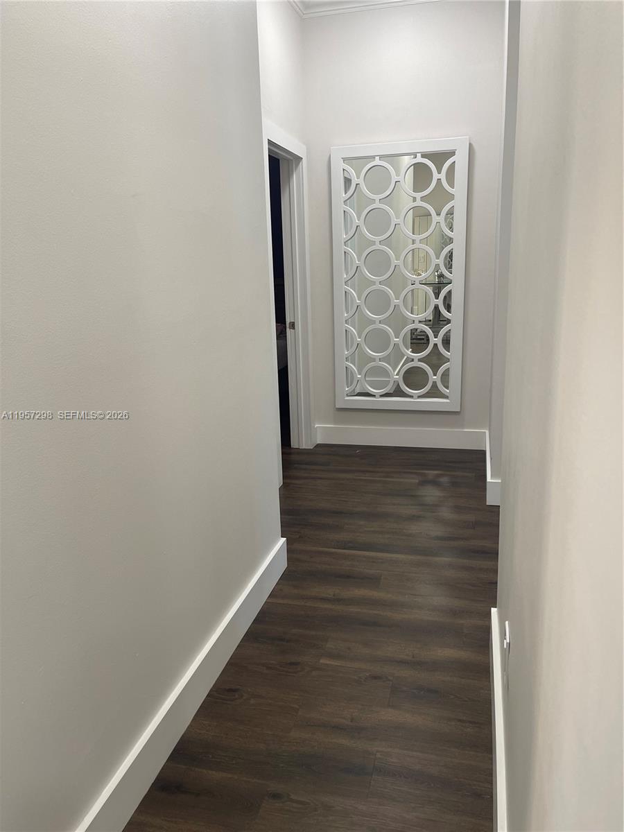 14200 Southwest 160th Court Miami, FL 33196 - Photo 14 of 36 a view of an empty room with wooden floor and a window