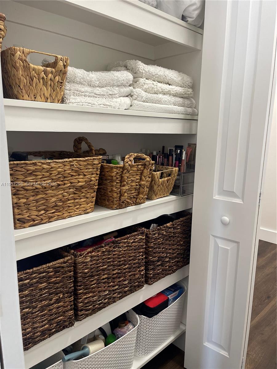 14200 Southwest 160th Court Miami, FL 33196 - Photo 15 of 36 a close view of water heater and wooden cabinets