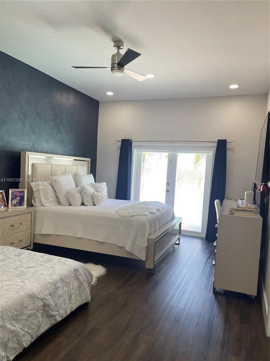 14200 Southwest 160th Court Miami, FL 33196 - Photo 16 of 36 a bedroom with a bed and window