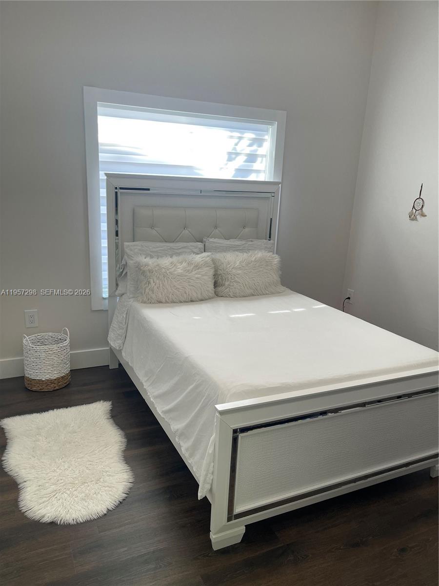 14200 Southwest 160th Court Miami, FL 33196 - Photo 23 of 36 a bedroom with a bed and a window