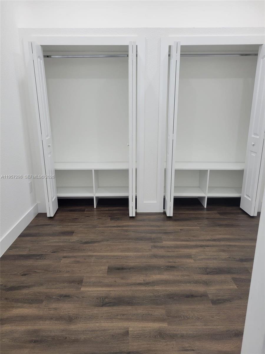 14200 Southwest 160th Court Miami, FL 33196 - Photo 27 of 36 a view of room with wooden floor and white wall