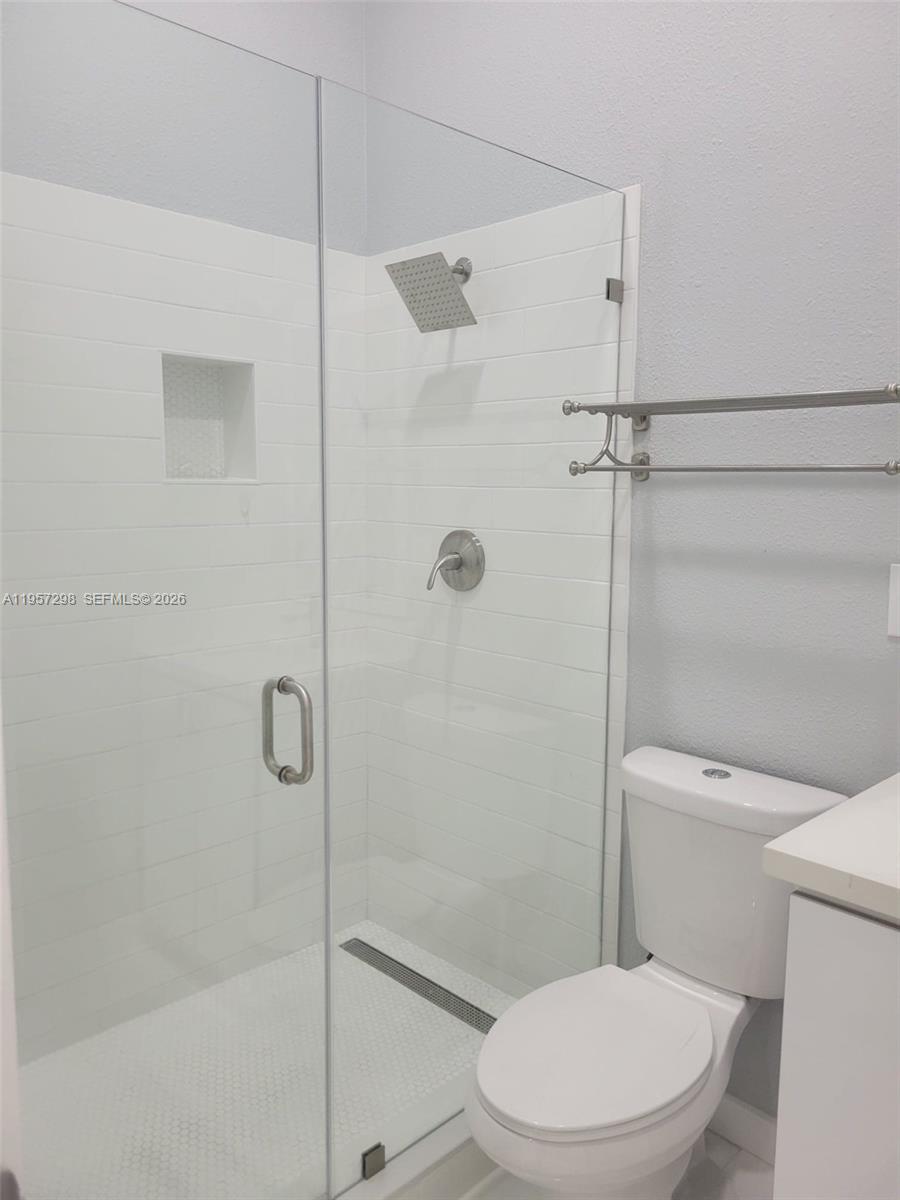 14200 Southwest 160th Court Miami, FL 33196 - Photo 28 of 36 a white toilet next to a bathroom