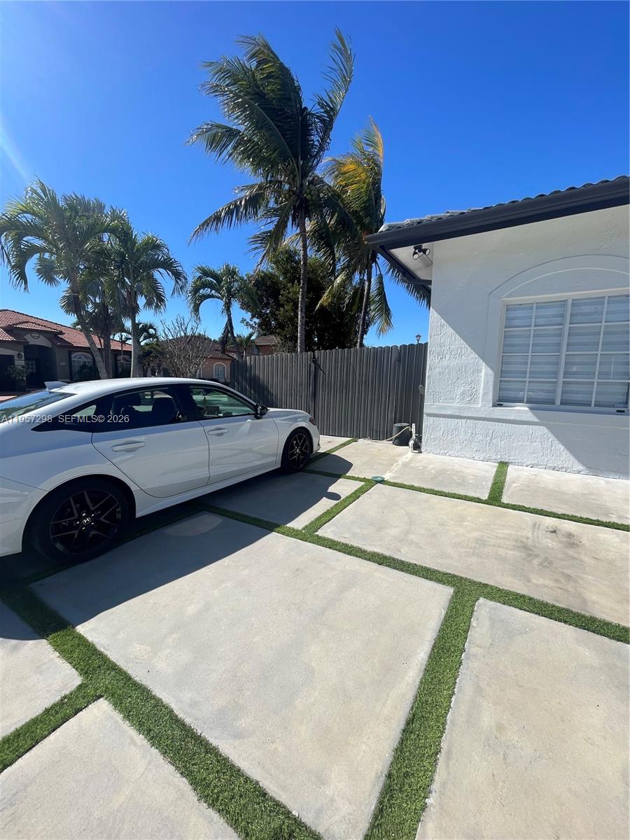 14200 Southwest 160th Court Miami, FL 33196 - Photo 5 of 36 a view of outdoor space with swimming pool and furniture