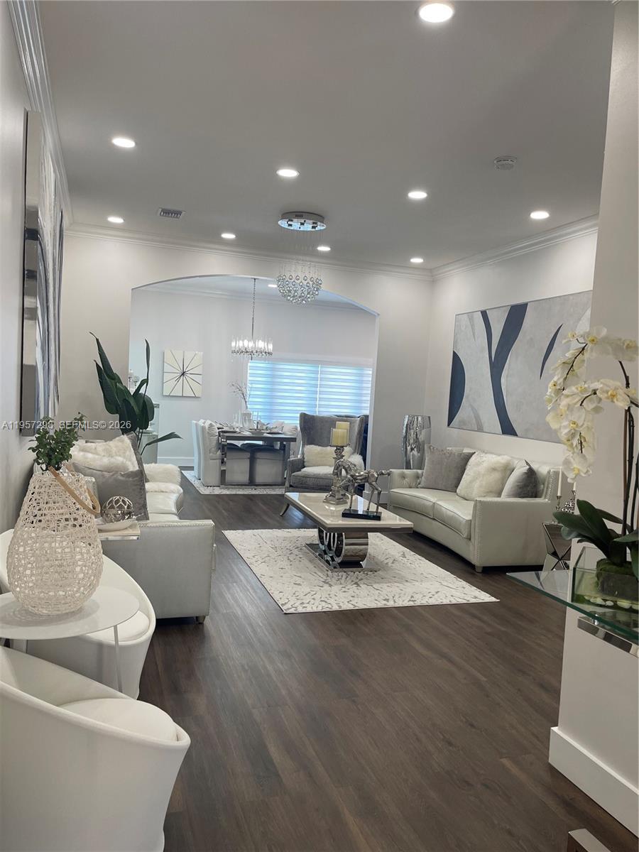 14200 Southwest 160th Court Miami, FL 33196 - Photo 7 of 36 a living room with furniture and a wooden floor