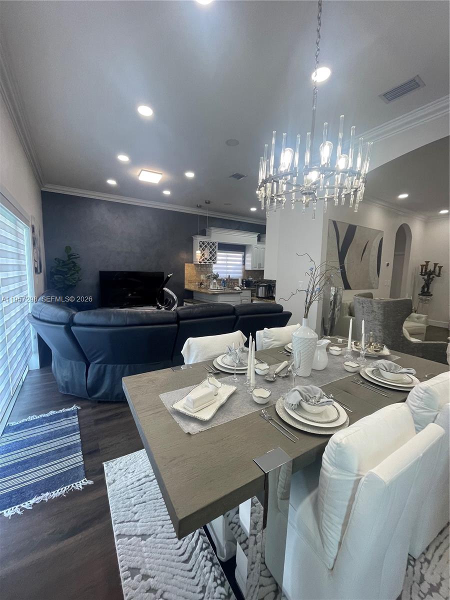 14200 Southwest 160th Court Miami, FL 33196 - Photo 8 of 36 a view of a dining room with furniture