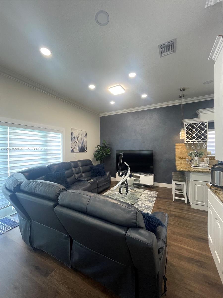 14200 Southwest 160th Court Miami, FL 33196 - Photo 9 of 36 a living room with furniture and kitchen view