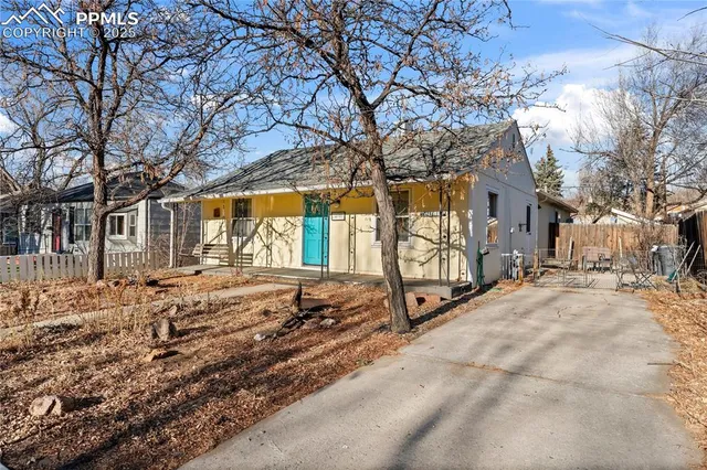 a view of backyard with large trees