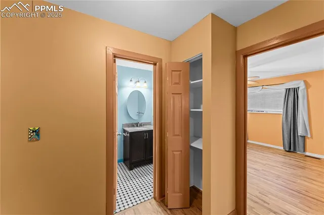 a view of a bathroom from a hallway