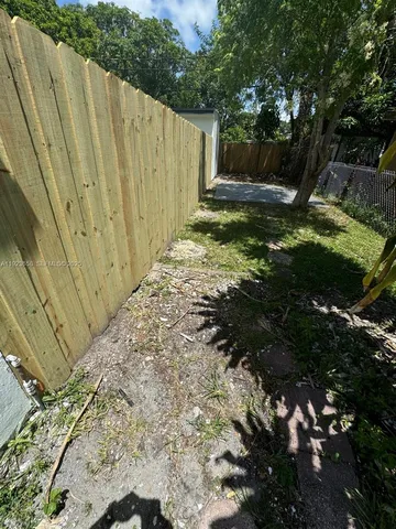 a view of backyard with green space