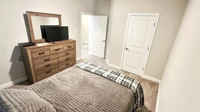 a view of a house with a garden and yard