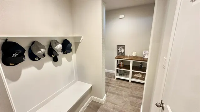 a kitchen with stainless steel appliances a sink a counter top space a large window and furniture