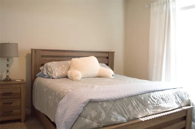 a bed room with a bed and a chandelier