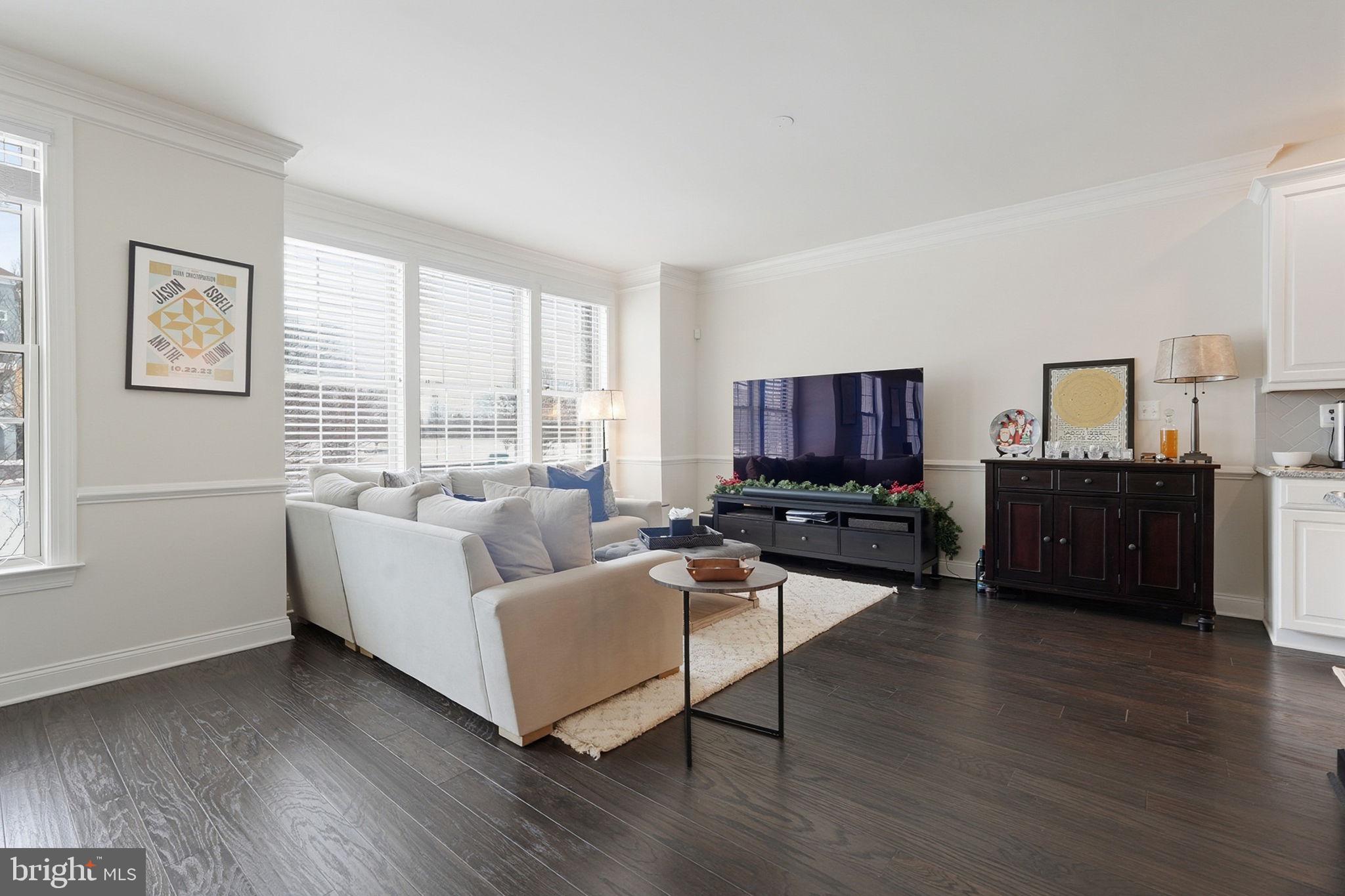 22597 Windsor Locks Square Ashburn, VA 20148 - Photo 14 of 44 a living room with furniture wooden floor and a window