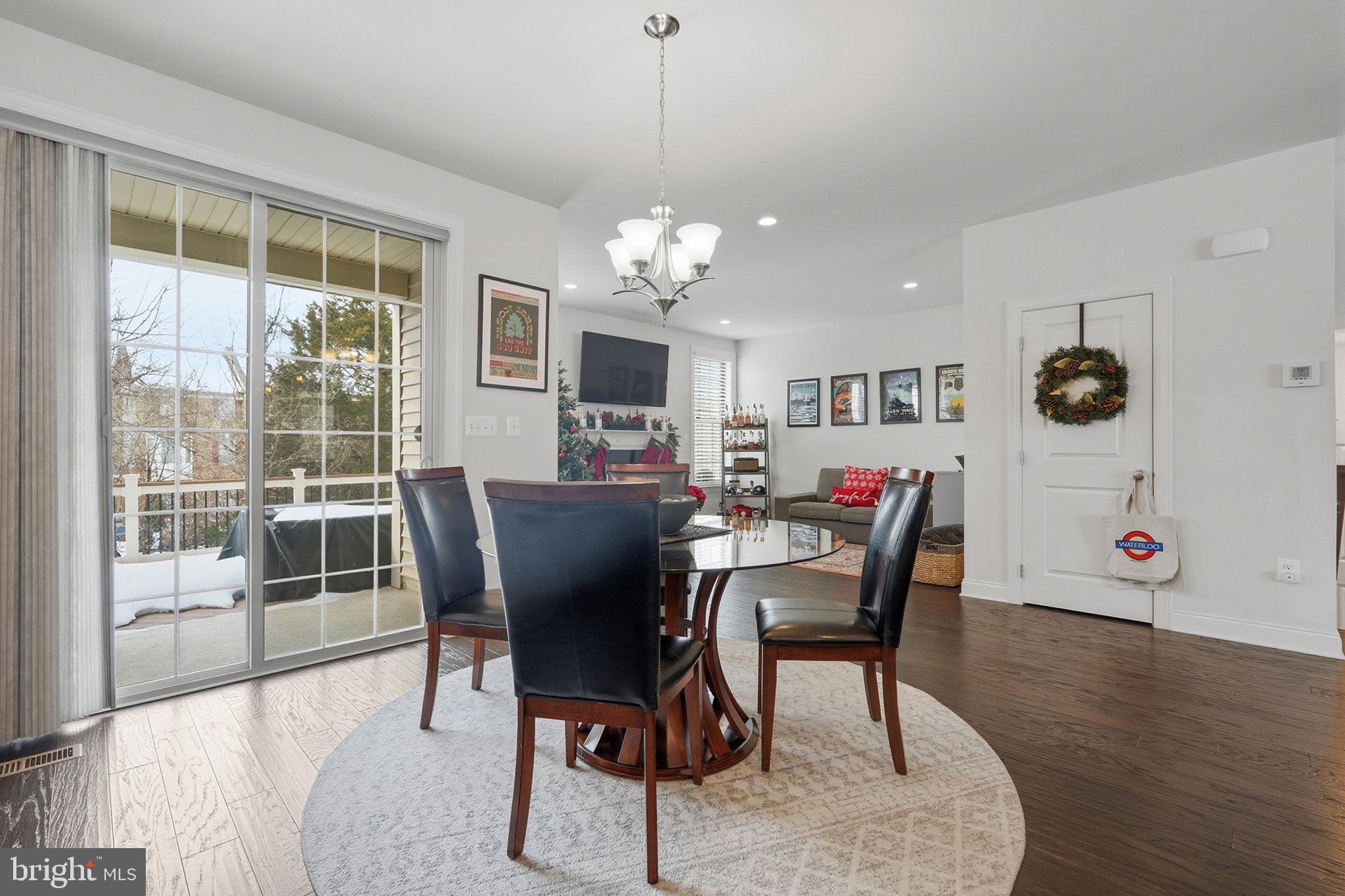 22597 Windsor Locks Square Ashburn, VA 20148 - Photo 15 of 44 a view of a dining room with furniture window and wooden floor
