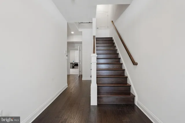 a view of entryway with wooden floor
